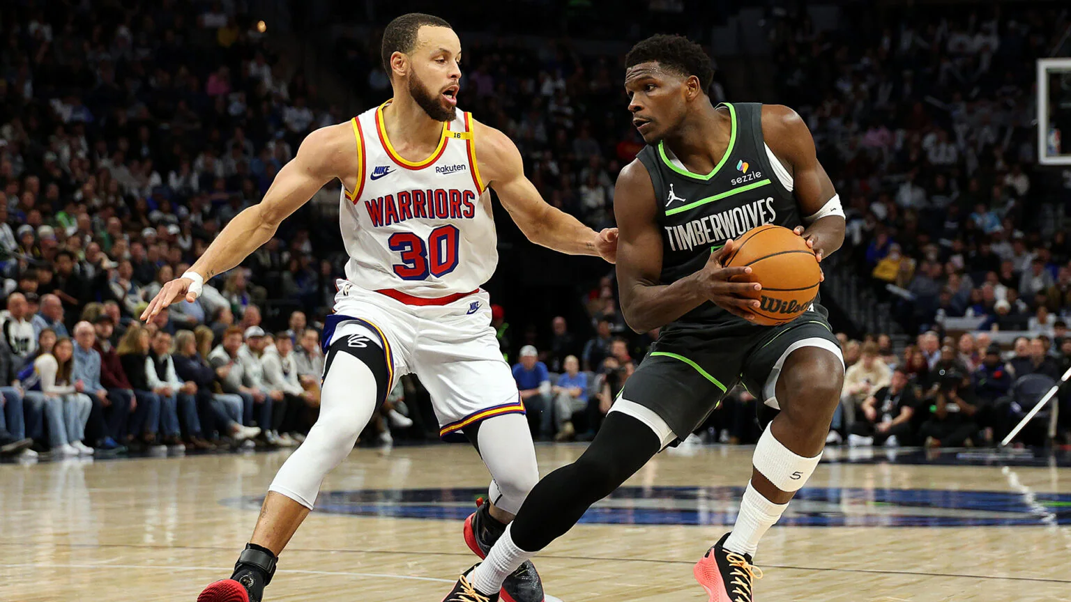 Stephen Curry and Anthony Edwards in action during the 2025 NBA Playoffs series between the Golden State Warriors and Minnesota Timberwolves.