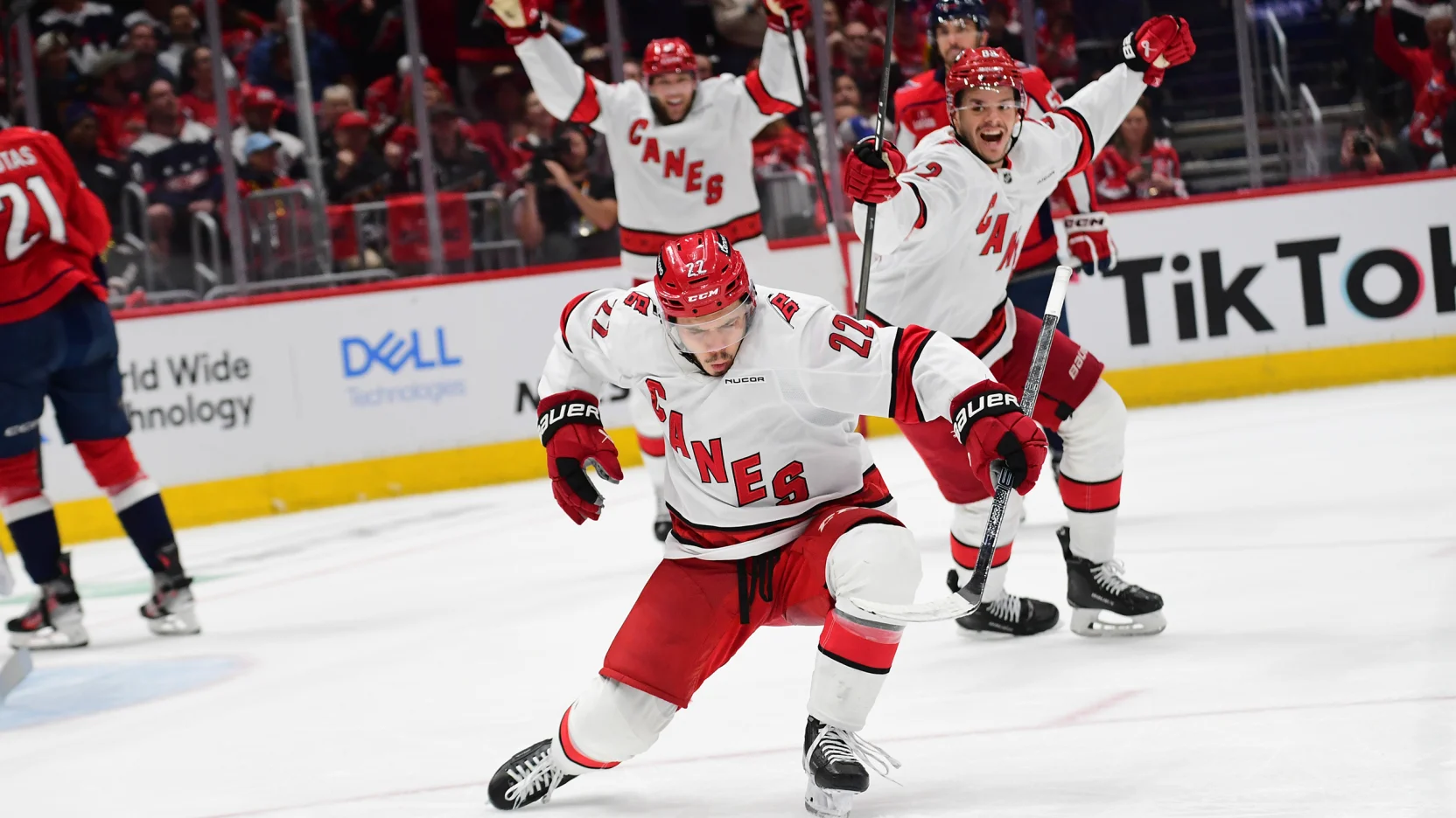 "Carolina Hurricanes celebrate their Game 1 overtime win in the playoffs, with Teuvo Teravainen scoring the game-winning goal, showcasing team resilience and determination."