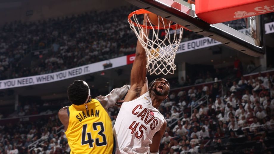 "Donovan Mitchell soaring through the air for a powerful poster dunk during Game 2 of the Cleveland Cavaliers vs. Indiana Pacers playoff series, electrifying the crowd and showcasing his athleticism and dominance."